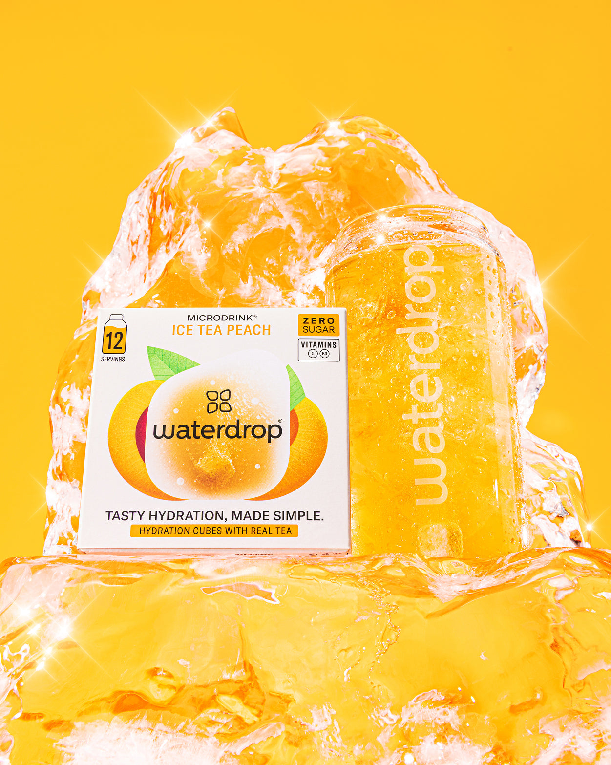Hydration Megapack Bottle Set with Ice Tea Peach cubes and glass.
