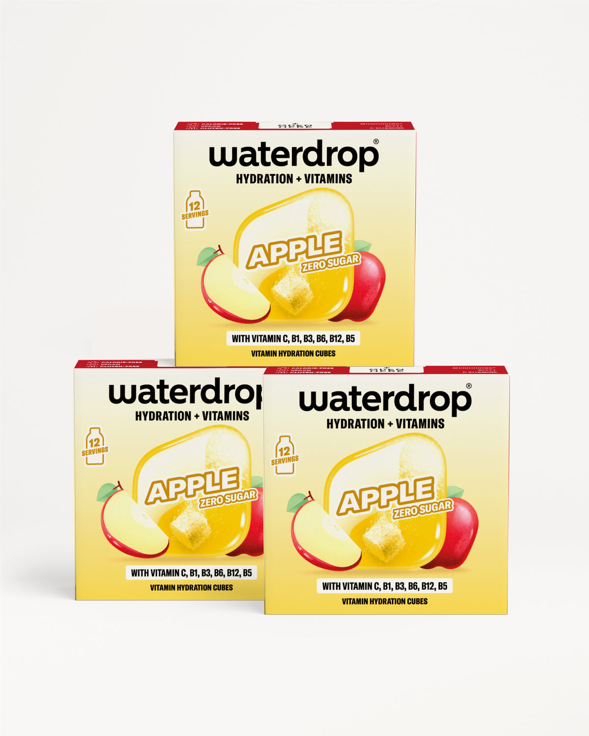 Trzy żółte pudełka Waterdrop z ilustracją jabłka, ułożone w trójkąt.